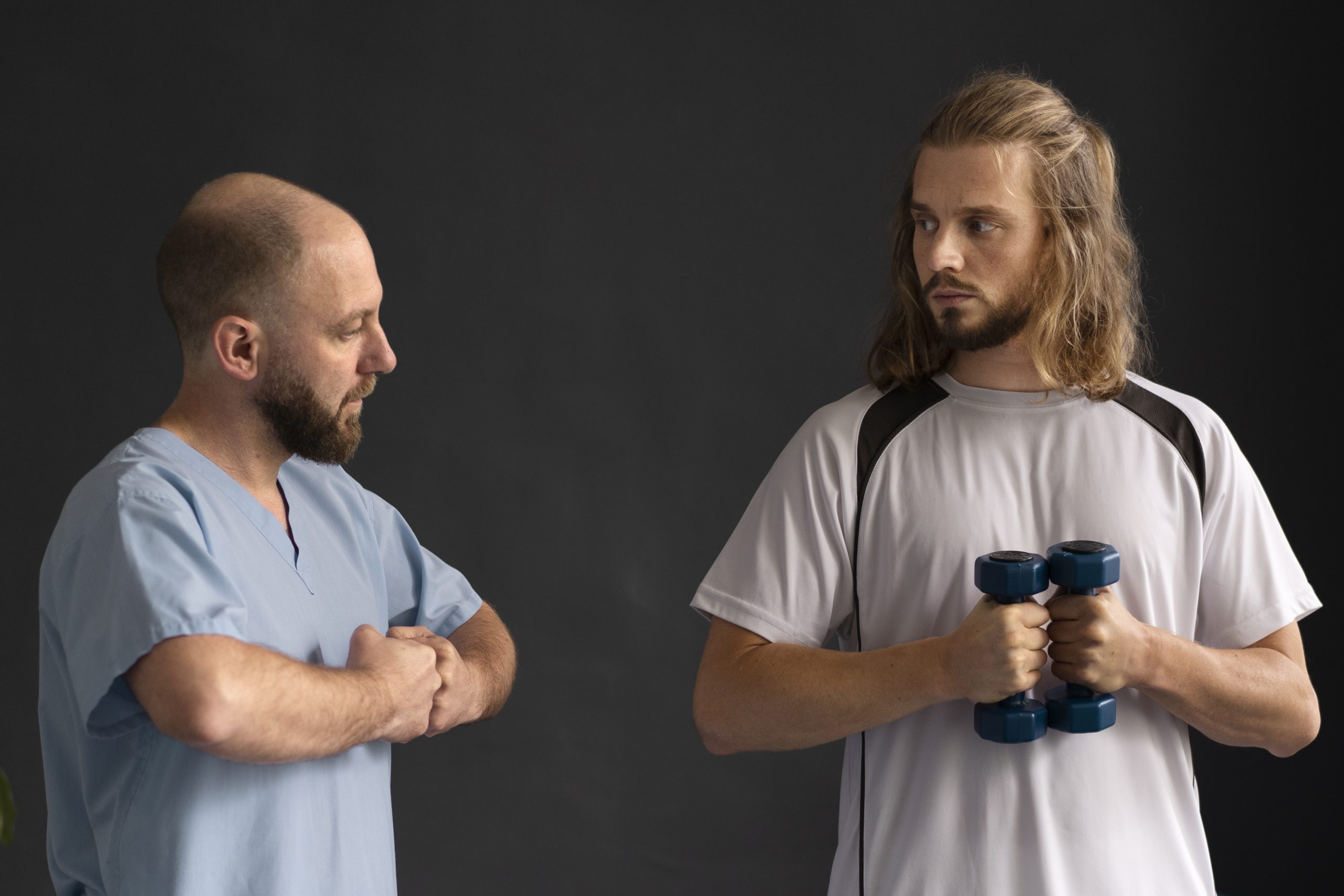Physiotherapist guiding an athlete through a supported exercise session