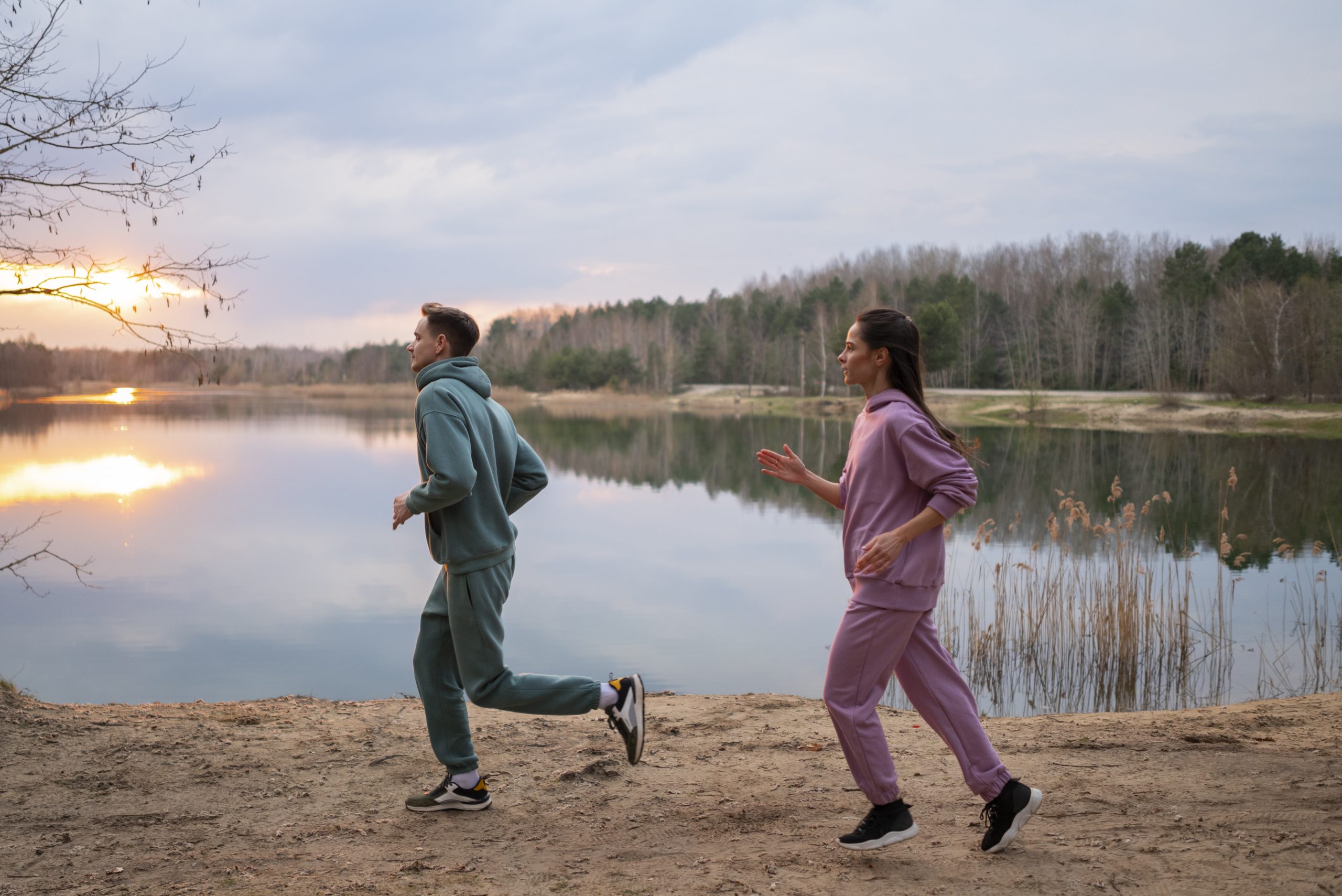 Couple running together outdoors as part of an active, balanced routine
