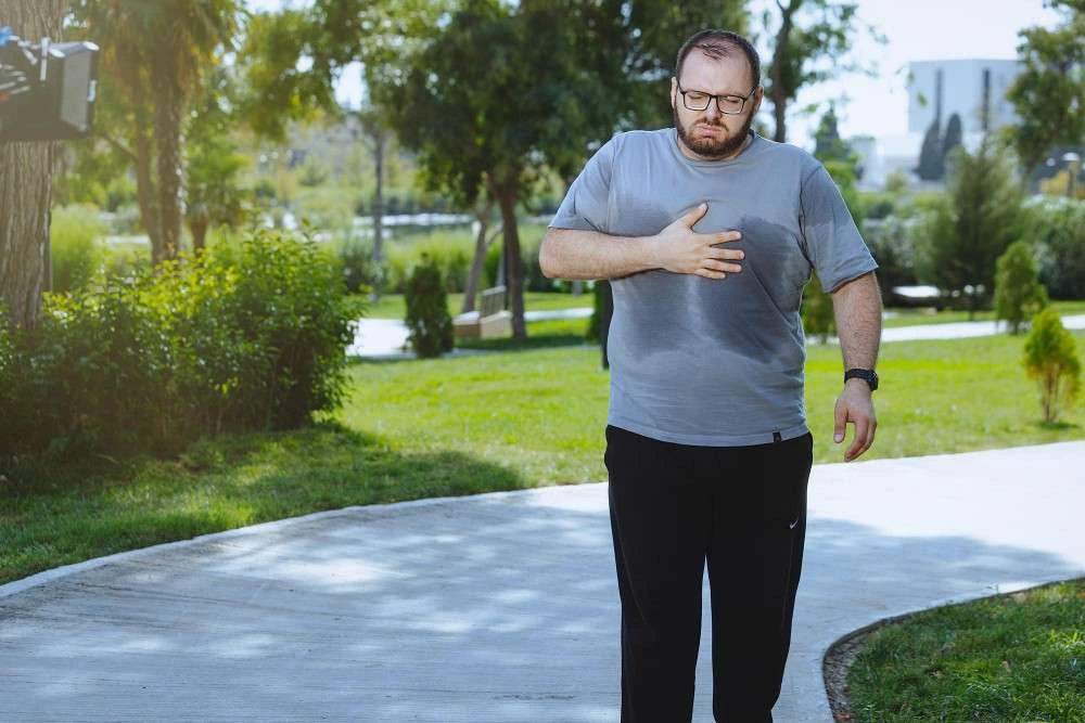 Illustration of obesity health risks including diabetes, hair loss, and shortness of breath