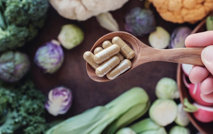 DIM supplements bottle with cruciferous vegetables