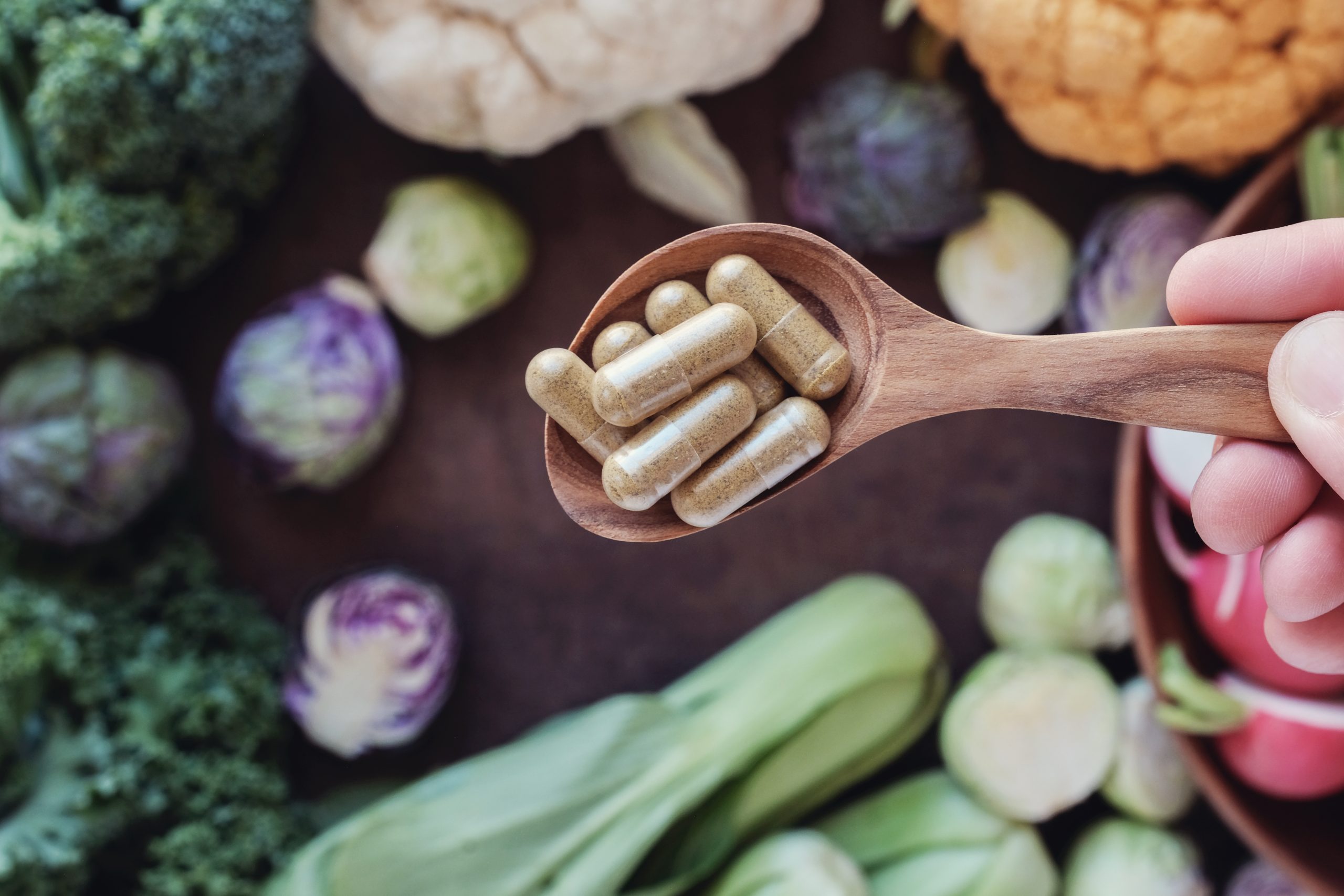 DIM Supplements for Weight Loss DIM supplements bottle with cruciferous vegetables