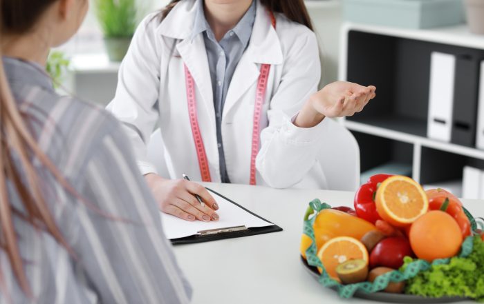 Doctor consulting patient at medical weight loss clinic for Phentermine