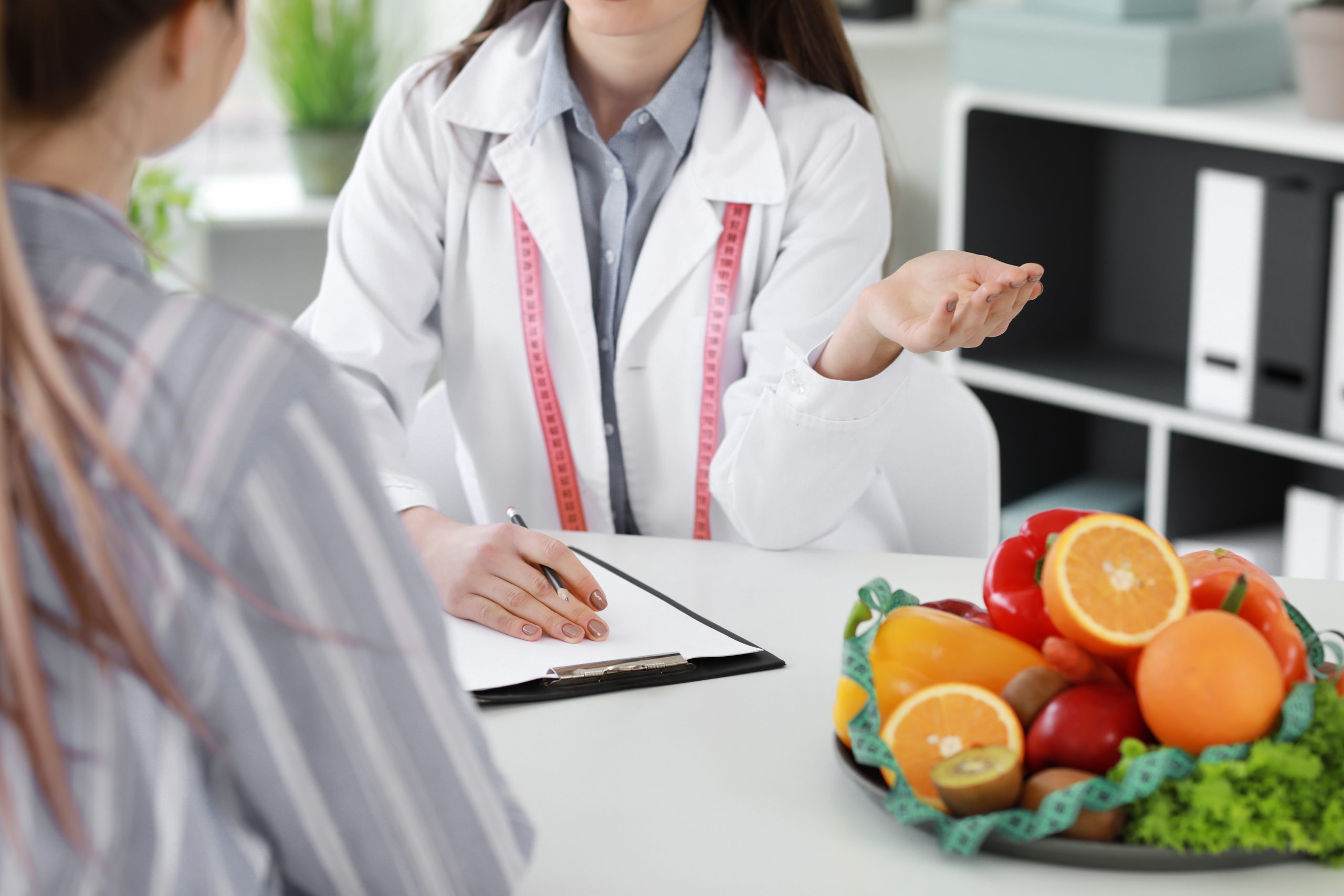 Medical Weight Loss Clinic Consultation Doctor consulting patient at medical weight loss clinic for Phentermine